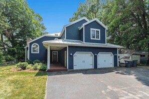 Exterior - Serene lakefront retreat with an expansive deck, dock access, game room, & AC (Berrien Springs)