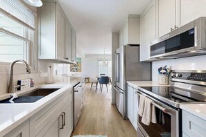 Fridge, microwave, oven, stovetop - Tranquil Lakeview Retreat in Suttons Bay, with a private sauna, & large yard (Suttons Bay)
