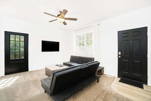 TV, offices - Secluded & contemporary cottage with a washer/dryer, central AC, & firepit (Honor)