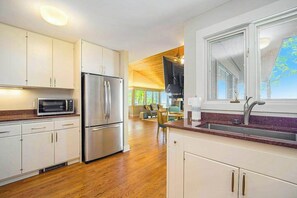 Fridge, microwave, oven, stovetop - Secluded lake-view home with large deck, private gas grill, AC (Harbor Springs)