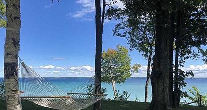 Dog-friendly secluded home near Suttons Bay with water views, firepit, fireplace