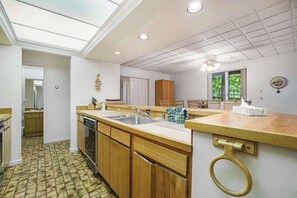 Fridge, microwave, oven, stovetop - Stylish retreat with a full kitchen, sunroom, & W/D access (Glen Arbor)