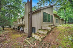 Exterior - Two-story home with a patio, sunroom, balcony, & washer/dryer access (Glen Arbor)
