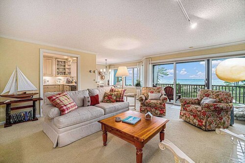 Lake-view condo with private beach, fireplace, deck, washer/dryer, streaming