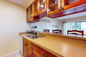 Fridge, microwave, oven, stovetop - Riverfront condo with lake and river access, fireplace, firepit & gym (Glen Arbor)