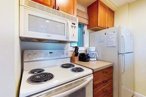 Fridge, microwave, oven, stovetop - Riverfront condo with lake and river access, fireplace, firepit & gym (Glen Arbor)