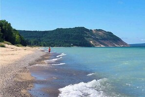 On the beach - Lakefront cabin with 100 ft of Lake Michigan beach, full kitchen, loft, & deck (Empire)