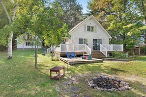 Terrace/patio - Cottage with lake views, private dock & firepit - near public boat launch (Boyne City)