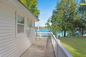 Terrace/patio - Cottage with lake views, private dock & firepit - near public boat launch (Boyne City)