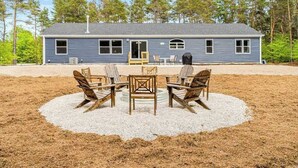 A two-story house with a covered patio area. - Four-season retreat with fireplace, firepit, grill, WiFi & central AC (Thompsonville)