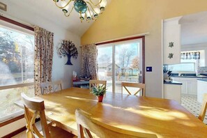 Dining - Cottage on the canal to Burt Lake with large patio and space for boat (Indian River)
