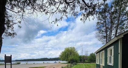 Cozy cottage with water views, spacious lawn, patio, & WiFi