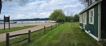 Cozy cottage with water views, spacious lawn, patio, & WiFi