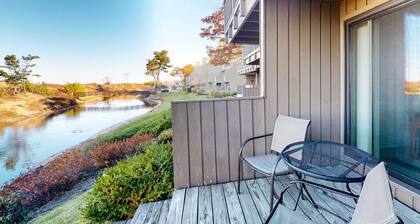 Riverfront condo with beach access to lake, fireplace, washer/dryer & cable