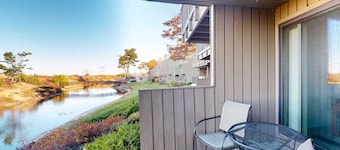 Riverfront condo with beach access to lake, fireplace, washer/dryer & cable