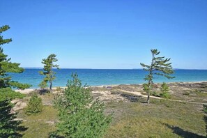 On the beach - Darling condo on Lake Michigan with washer/dryer, deck, lake views, fireplace (Glen Arbor)