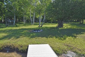 Property grounds - Lakefront home on Little Glen Lake with fireplace, deck, gas grill, and firepit (Empire)