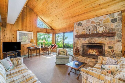 Rustic dream-home w/ lake views, wraparound deck, & wood-burning fireplace