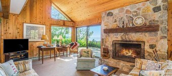 Rustic dream-home w/ lake views, wraparound deck, & wood-burning fireplace