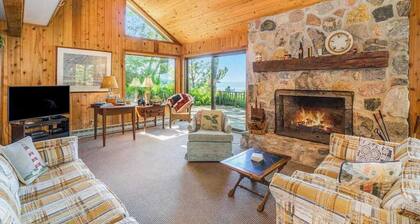 Rustic dream-home w/ lake views, wraparound deck, & wood-burning fireplace