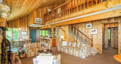Rustic dream-home w/ lake views, wraparound deck, & wood-burning fireplace