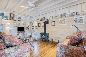 TV, fireplace, offices - Calming Cottage on the River W/ Furnished Porch, Lofted Layout & Ideal Location (Saugatuck)