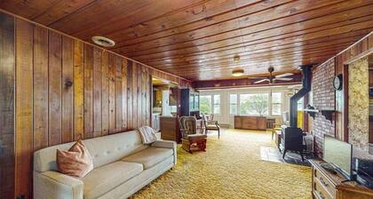 Rustic Cottage w/ dock access, kayaks, and year-round adventures in East Jordan