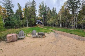 Property grounds - Lakeside luxury Home‚ dock, firepit, and easy access to Michigan's best towns! (East Jordan)