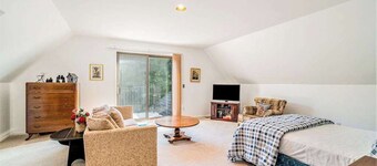 Dog-friendly, lake view home with three season room, fireplace, video projector