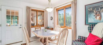 Dog-friendly, lake view home with three season room, fireplace, video projector