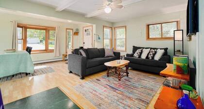 Dog-friendly cottage with fenced yard, firepit, W/D, & WiFi - walkable location