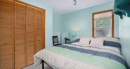 Dog-friendly cottage with fenced yard, firepit, W/D, & WiFi - walkable location