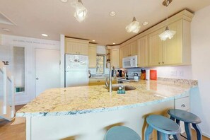 Fridge, microwave, oven, stovetop - Riverfront condo near the lake with beach access, fireplace, balcony & cable (Glen Arbor)