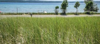 Rustic getaway on Crystal Lake w/ firepit, guest house & private dock