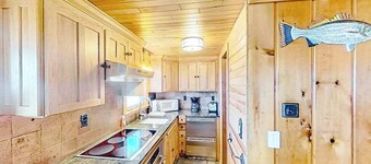 Rustic getaway on Crystal Lake w/ firepit, guest house & private dock