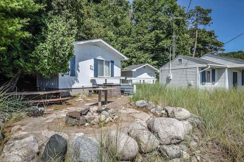 Rustic getaway on Crystal Lake w/ firepit, guest house & private dock