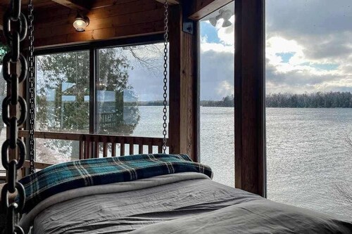 Lakefront home with private beach, lake views, dock, kayaks, firepit, grill, W/D