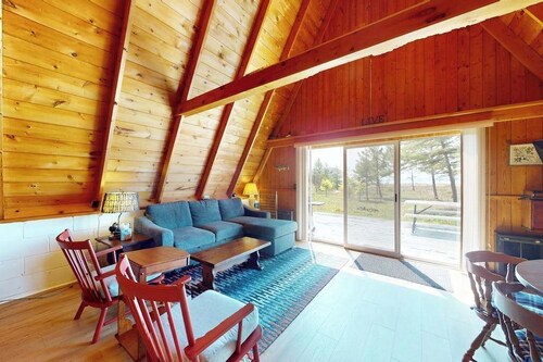 Rustic A-Frame Retreat on Grand Traverse Bay w/ beach, Wi-Fi, fire pit & grill