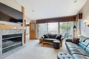 TV, fireplace, offices - Lakefront condo with deck, gorgeous view, fireplace, & W/D (Glen Arbor)