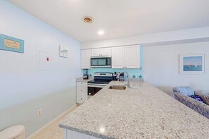 Fridge, microwave, oven, stovetop - Comfortable condo with deck, heated pool, and family-friendly amenities (Ocean City)