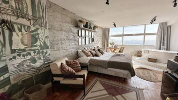 Apartamento, vista para a cidade | Área de estar