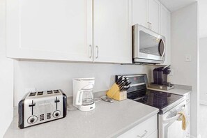 Fridge, microwave, oven, stovetop - Canalfront House w/ Private Deck, Central AC, Free WiFi, Bay Views, Washer/Dryer (Ocean City)