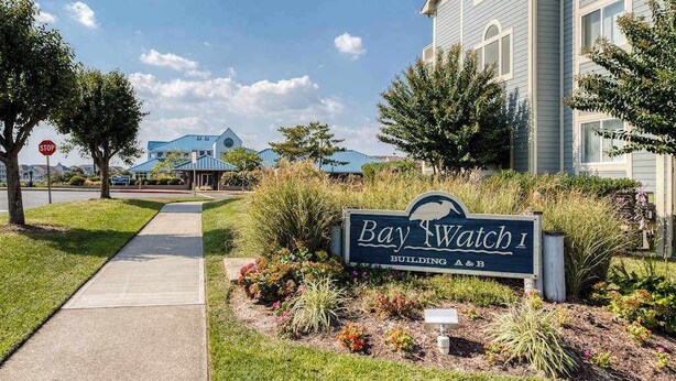 A sign for Bay Watch I Building A&B with a sidewalk and landscaping. - Baywatch I - 201B (Ocean City)