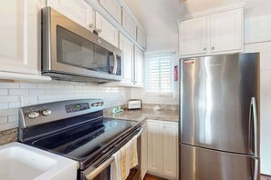 Fridge, microwave, oven, stovetop - Waterfront condo with scenic balcony, games, fireplace, & W/D - dog-friendly (Ocean City)