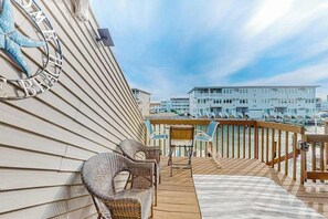 Outdoor dining - Waterfront condo with scenic balcony, games, fireplace, & W/D - dog-friendly (Ocean City)