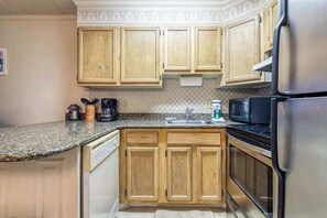 Fridge, microwave, oven, stovetop - Charming 1st-Floor Condo w/Private Balcony, Free WiFi, Partial A/C, and W/D (Ocean City)