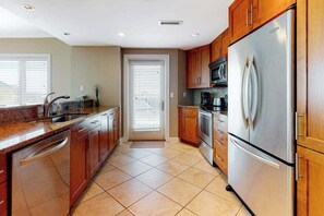 Fridge, microwave, oven, stovetop - Meridian Condo w/ Ocean View, WiFi, AC, W/D, Shared Pool/Gym - Steps to Beach (Ocean City)