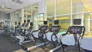 A gym with treadmills, elliptical machines, and weight equipment. - Gateway Grand 507 (Ocean City)