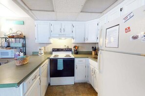 Fridge, microwave, oven, stovetop - First-Floor, Ocean Block Condo with Patio, AC, WiFi & Laundry - Steps to Beach (Ocean City)