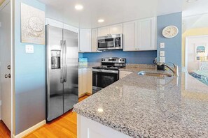 Fridge, microwave, oven, stovetop - Updated, ocean-view condo with balcony, pools, saunas, game room & gym (Ocean City)